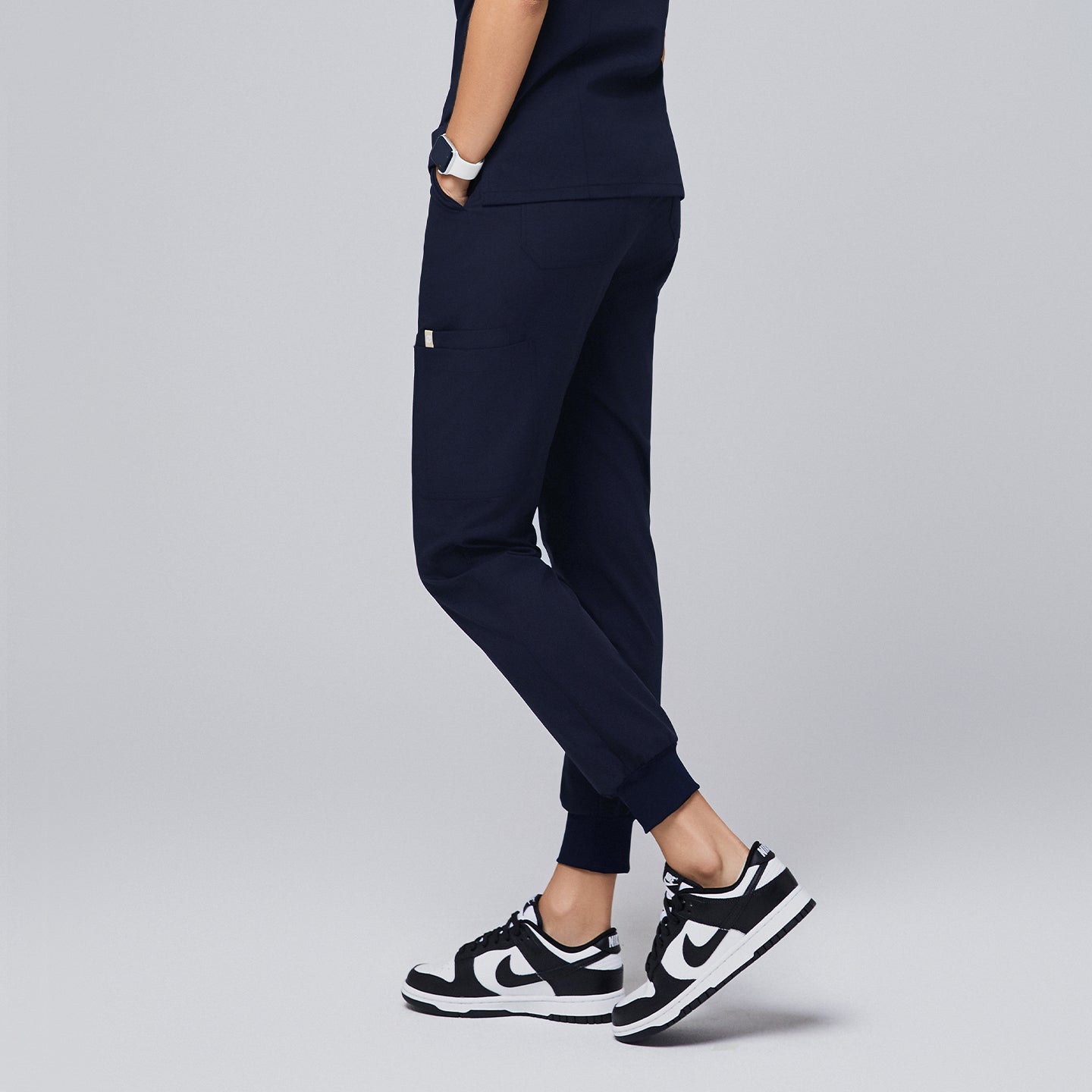 Image of Premium navy jogger scrub pants designed for a comfortable and active workday, featuring functional side pockets and cuffed hems for a tailored fit,Navy